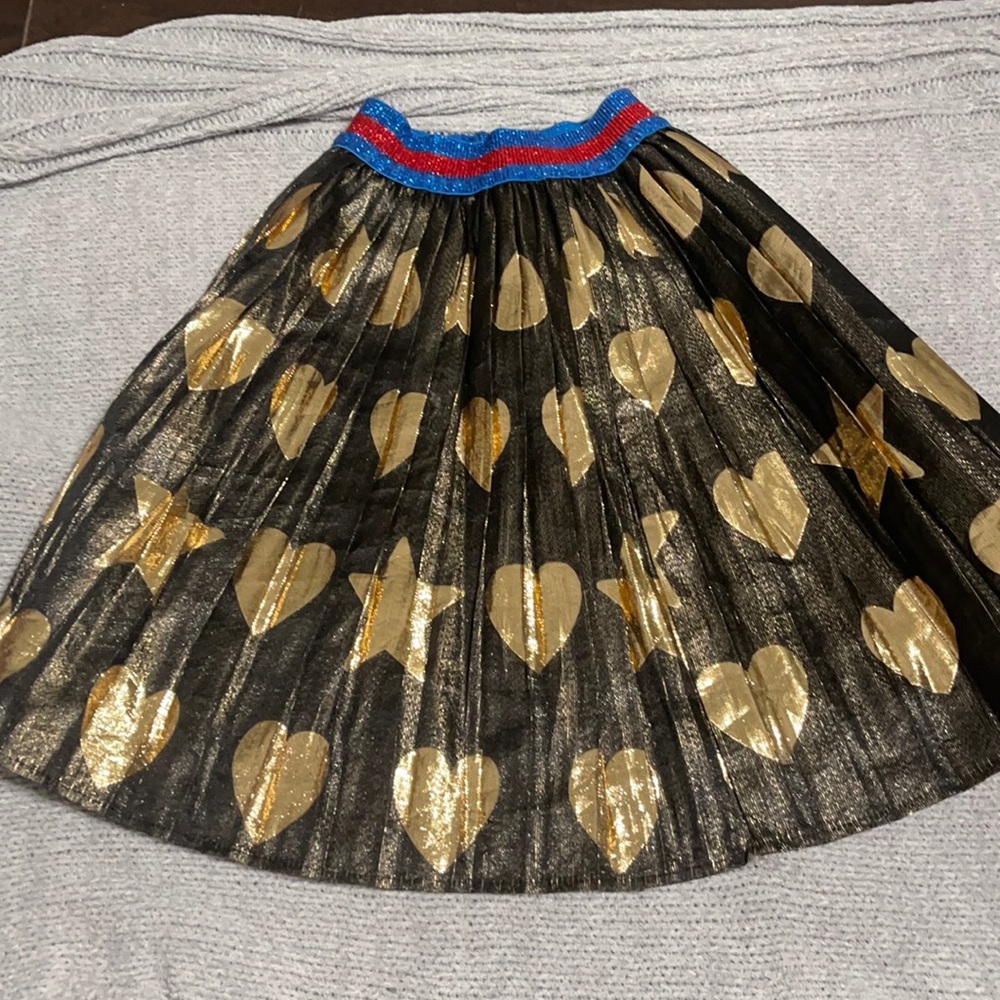 Gucci kids skirt black with gold with colorful strip on top of skirt :)